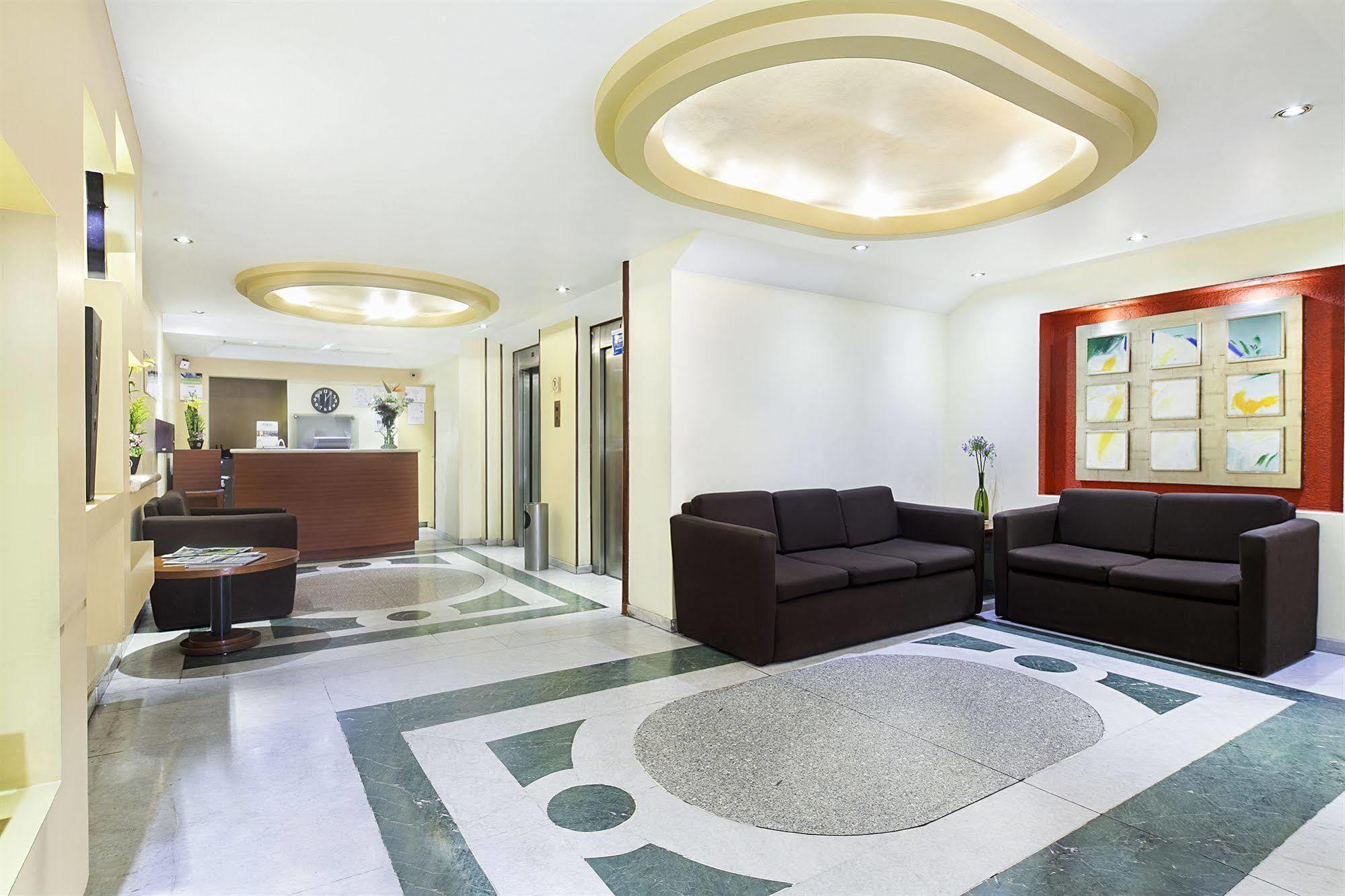 Exe Suites San Marino Mexico By Interiør billede Interior of the hotel